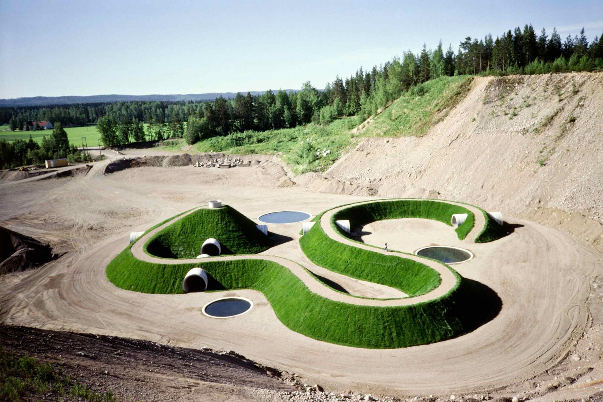 a curving mound of earth with tunnels and pathways throughout