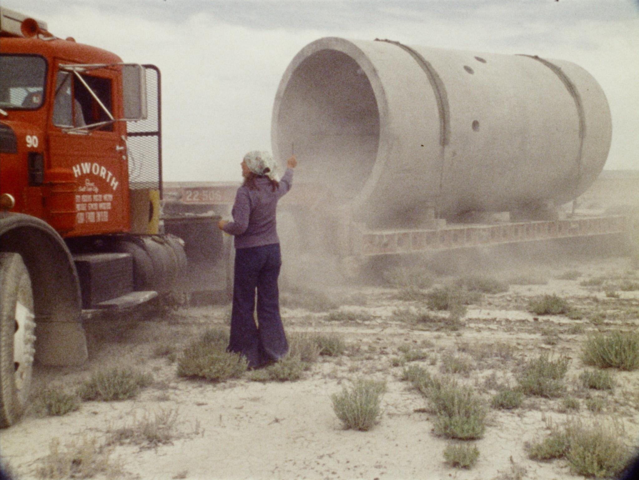 Still from Nancy Holt's film Sun Tunnels showing the construction of her earthwork