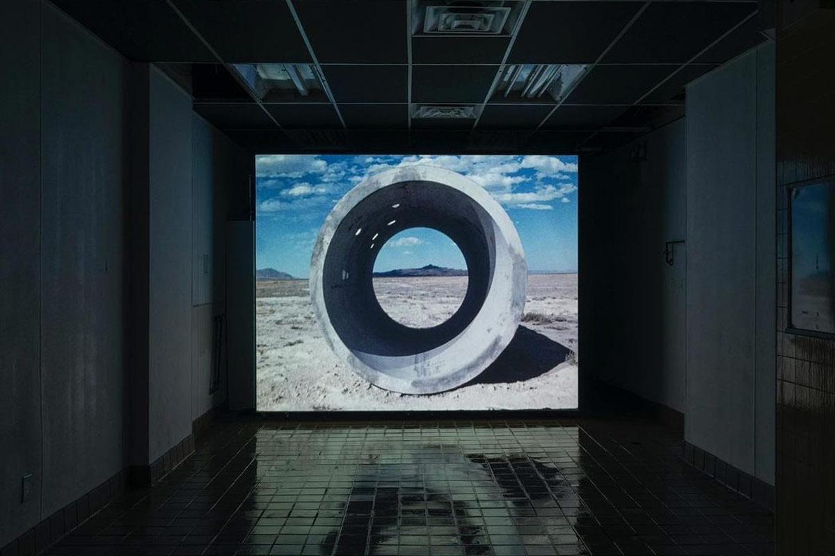a projection of the film Sun Tunnels