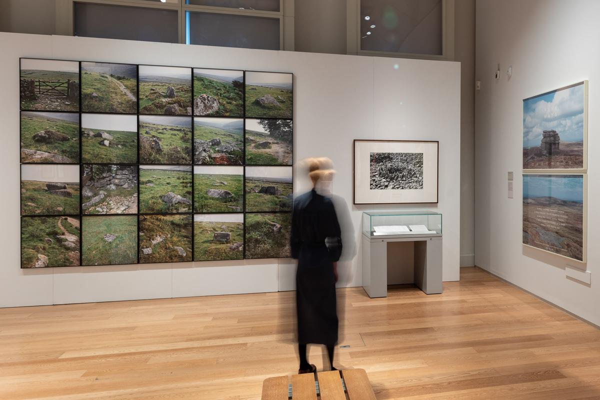 a gallery with photographs on the wall