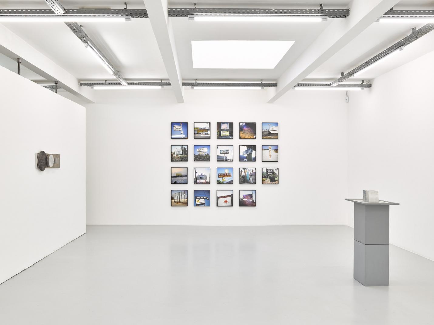 an exhibition in a white walled gallery