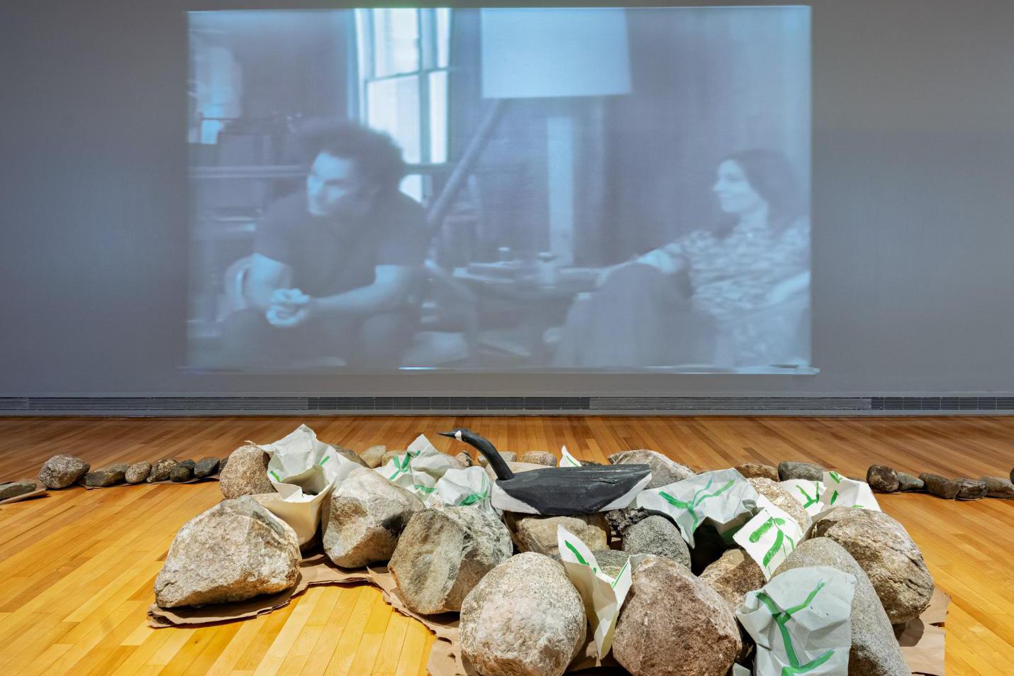 a video projection and a group of rocks