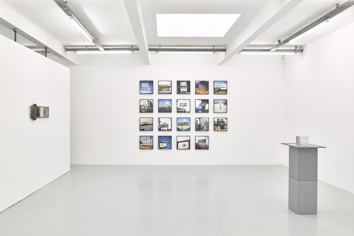 an exhibition in a white walled gallery