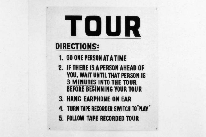 A sign with directions for an audio tour of the John Weber gallery