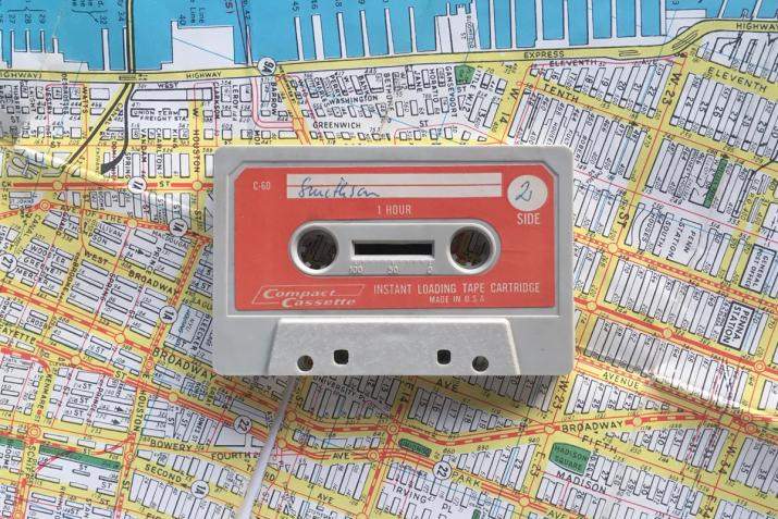 a casette tape on top of a map of Manhattan 