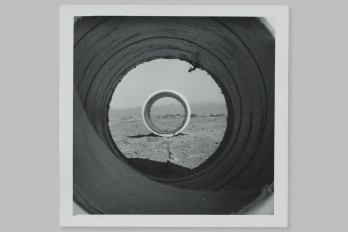looking through the center of nancy holt's sun tunnels model