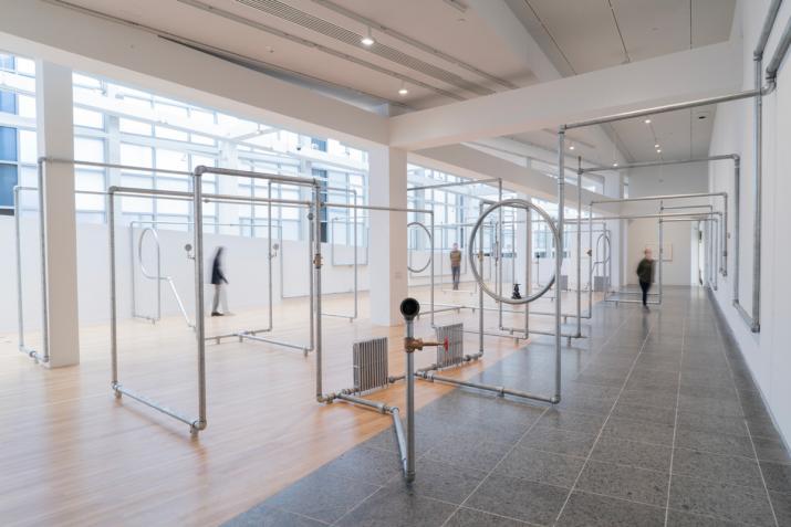 A network of hot water pipes in an exhibition space