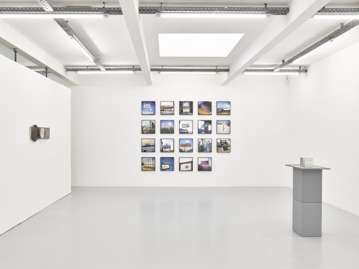 an exhibition in a white walled gallery