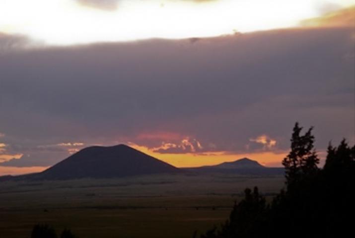 an image of an extinct volcano at sunset
