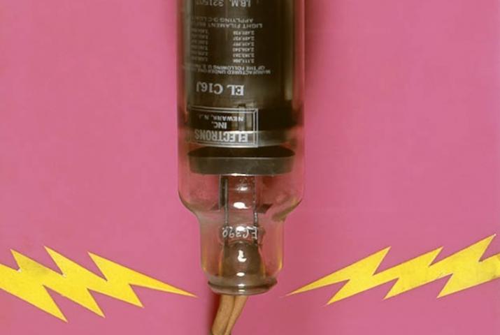 a machine on a hot pink background