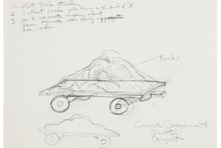 a flat bed trailer holding rocks