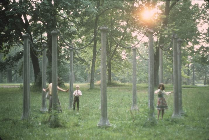 a sculpture comprising a circle of stone posts