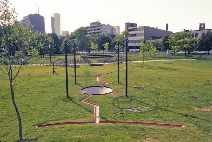 a drainage sculpture in a park