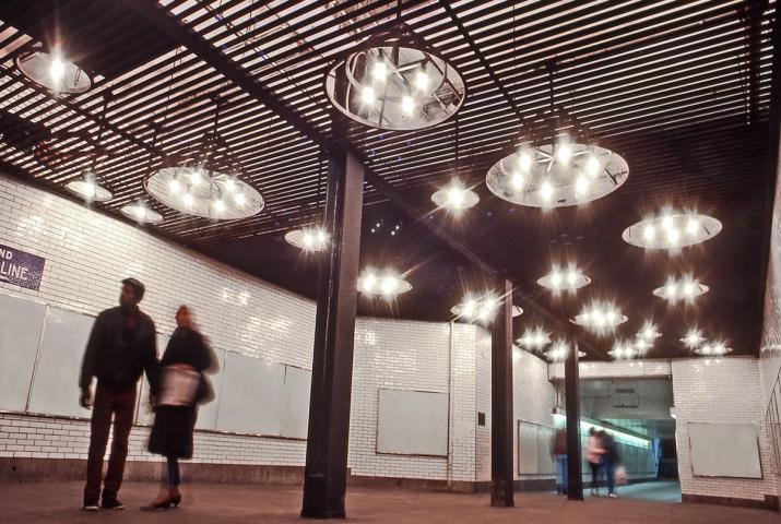 a ceiling light sculpture in the new york subway system
