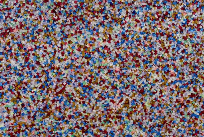 detail of a sculpture showing brightly colored Plexiglas fragments