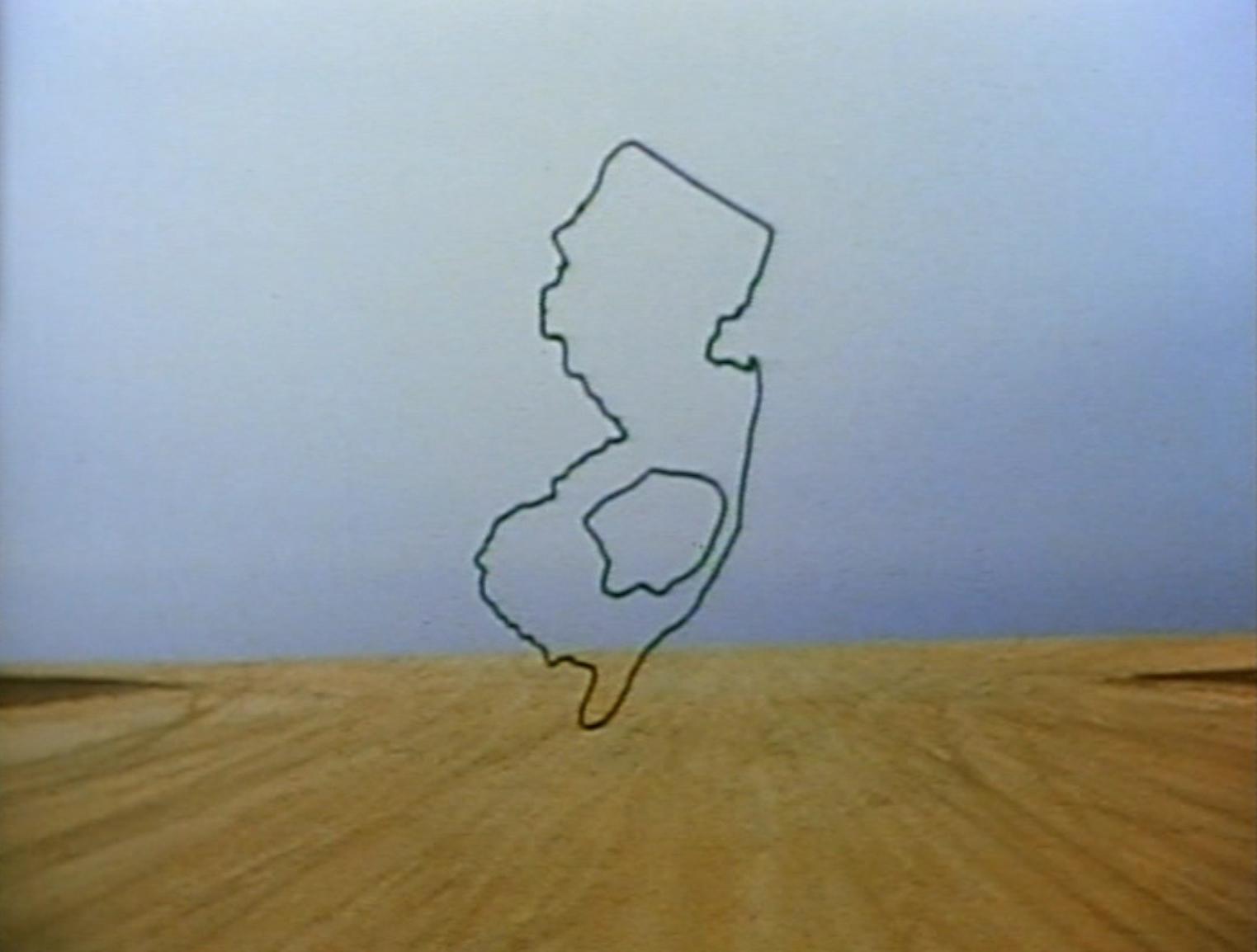 A still from the film Pine Barrens showing an outline of the state of New Jersey superimposed over a stark landscape.  