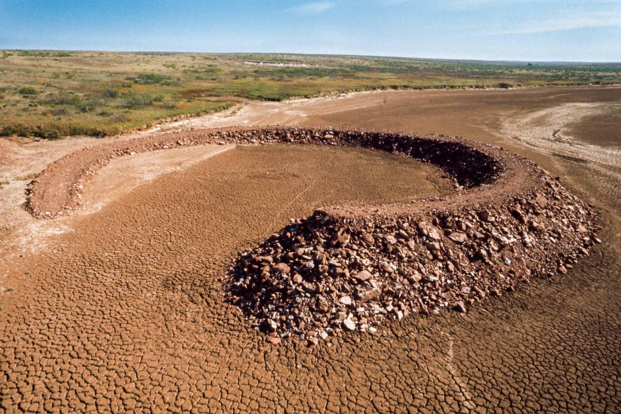 The earth and rock circle of Smithson's Amarillo Ramp spiraling out of the earth.