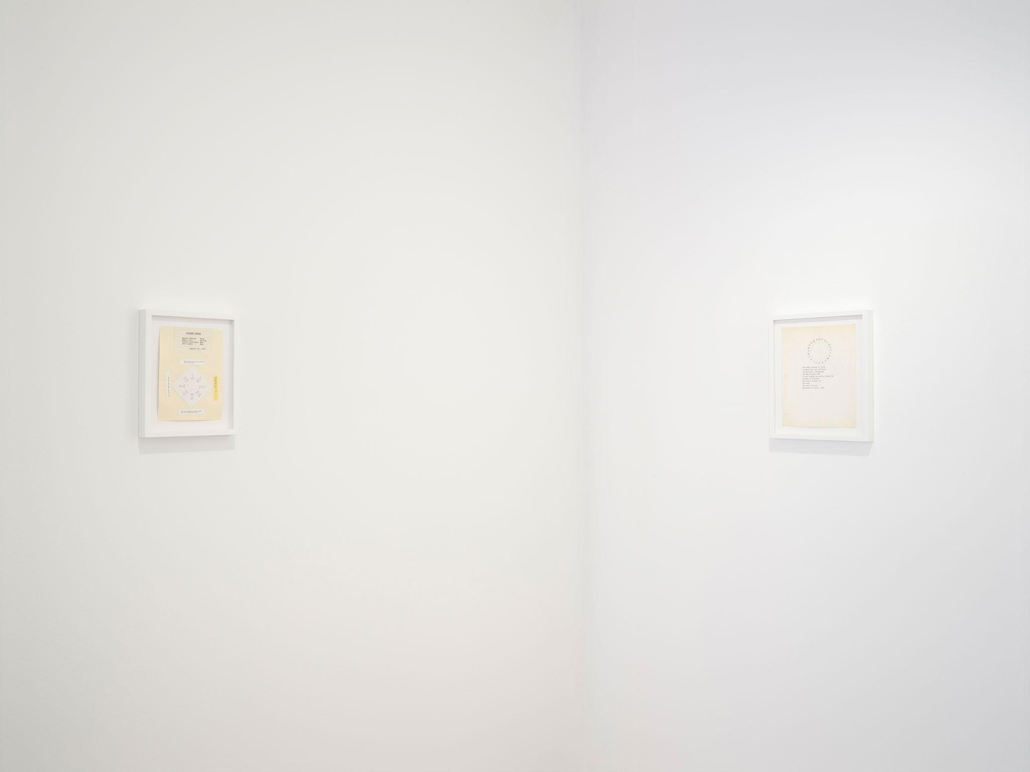 two framed works on paper hanging on a white wall