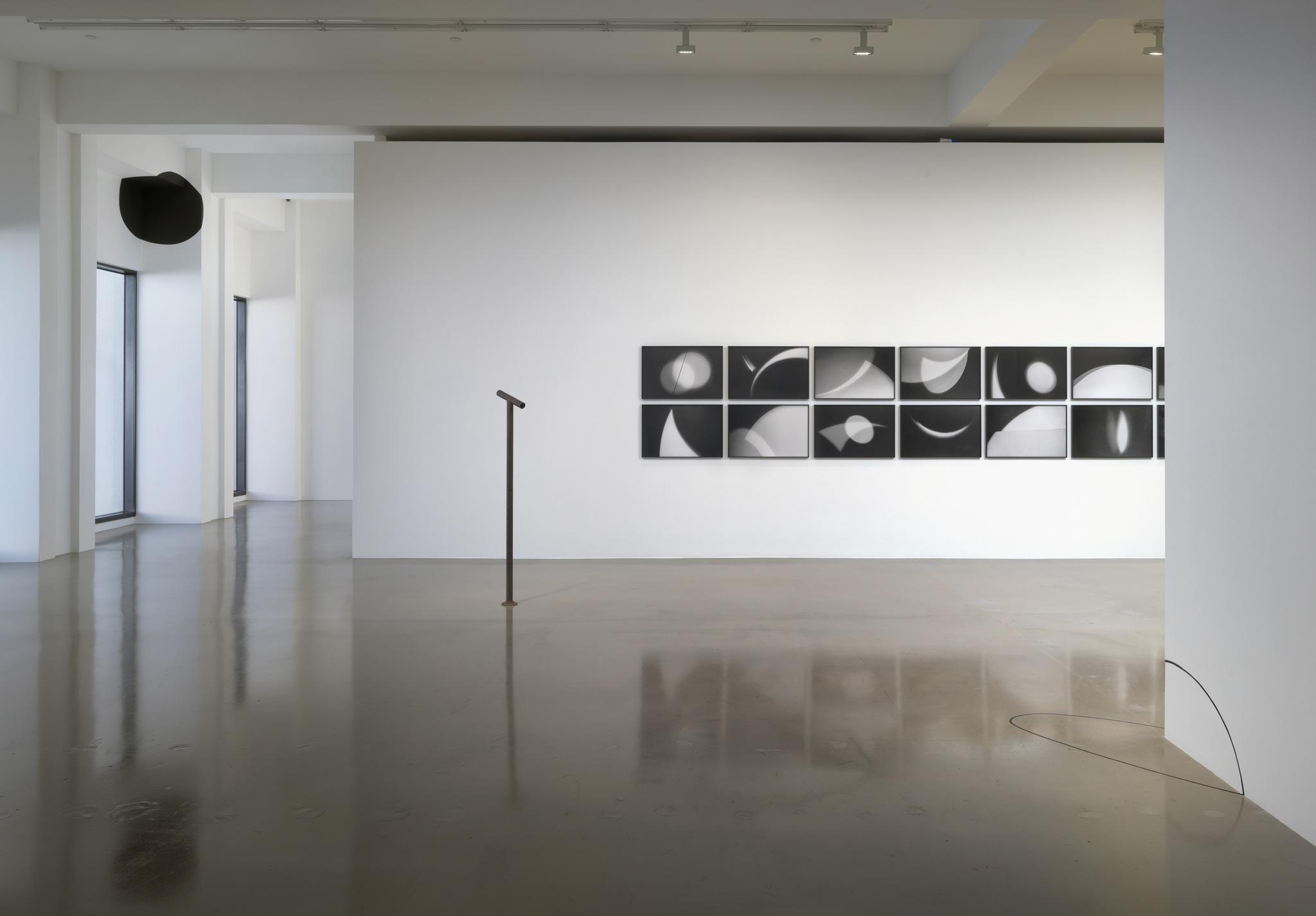 Installation view of a Locator and photographic work in Nancy Holt: Locating Perception