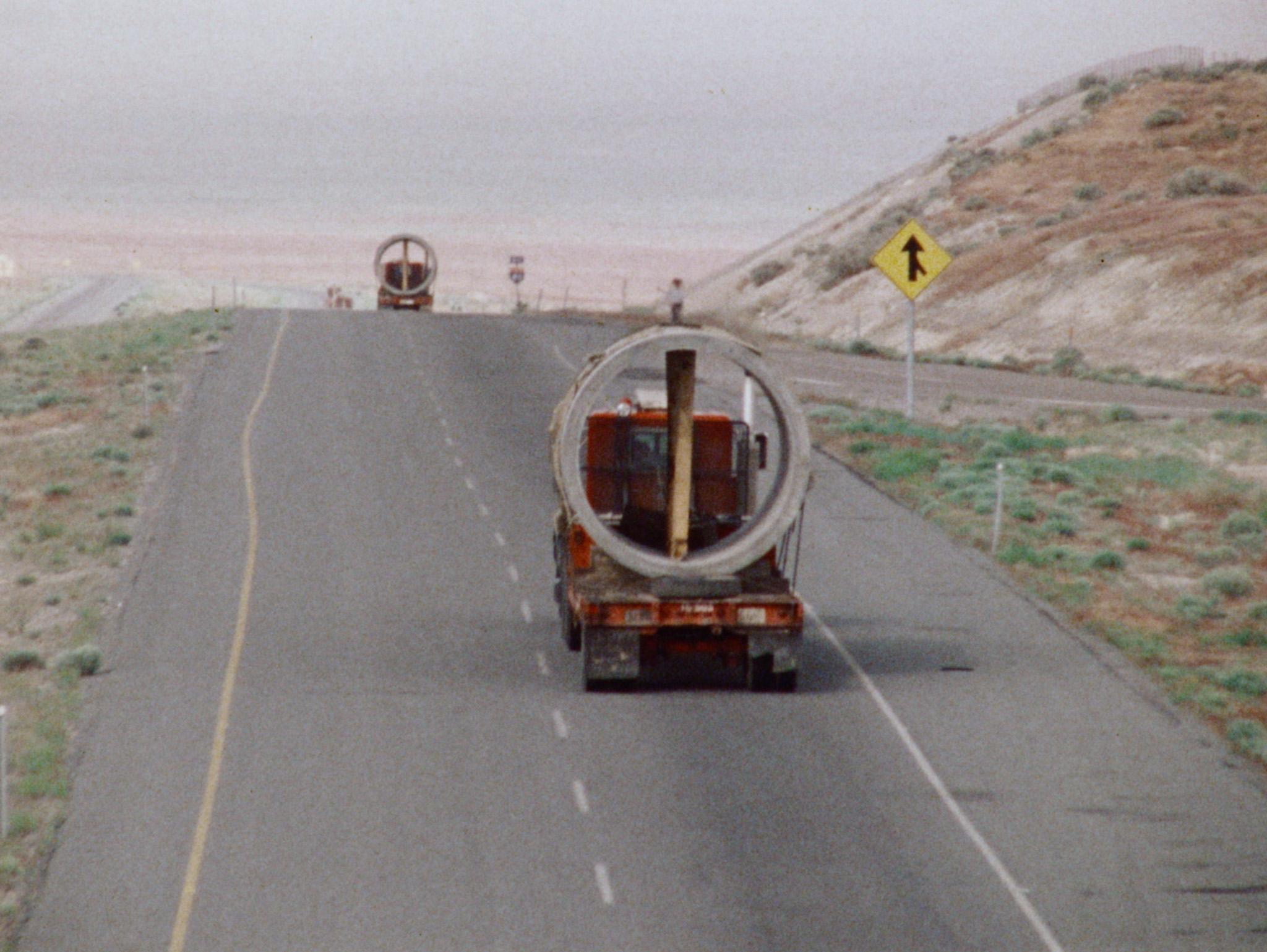 Still from Nancy Holt's film Sun Tunnels showing the construction of her earthwork