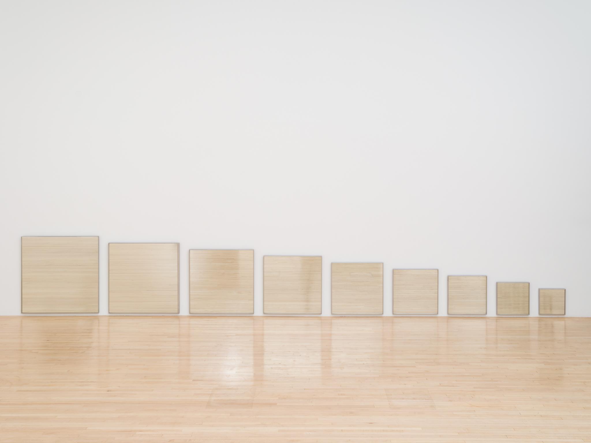 Robert Smithson's Mirage No. 1 on view. Nine mirrors hung near the floor reflecting the wooden floor.