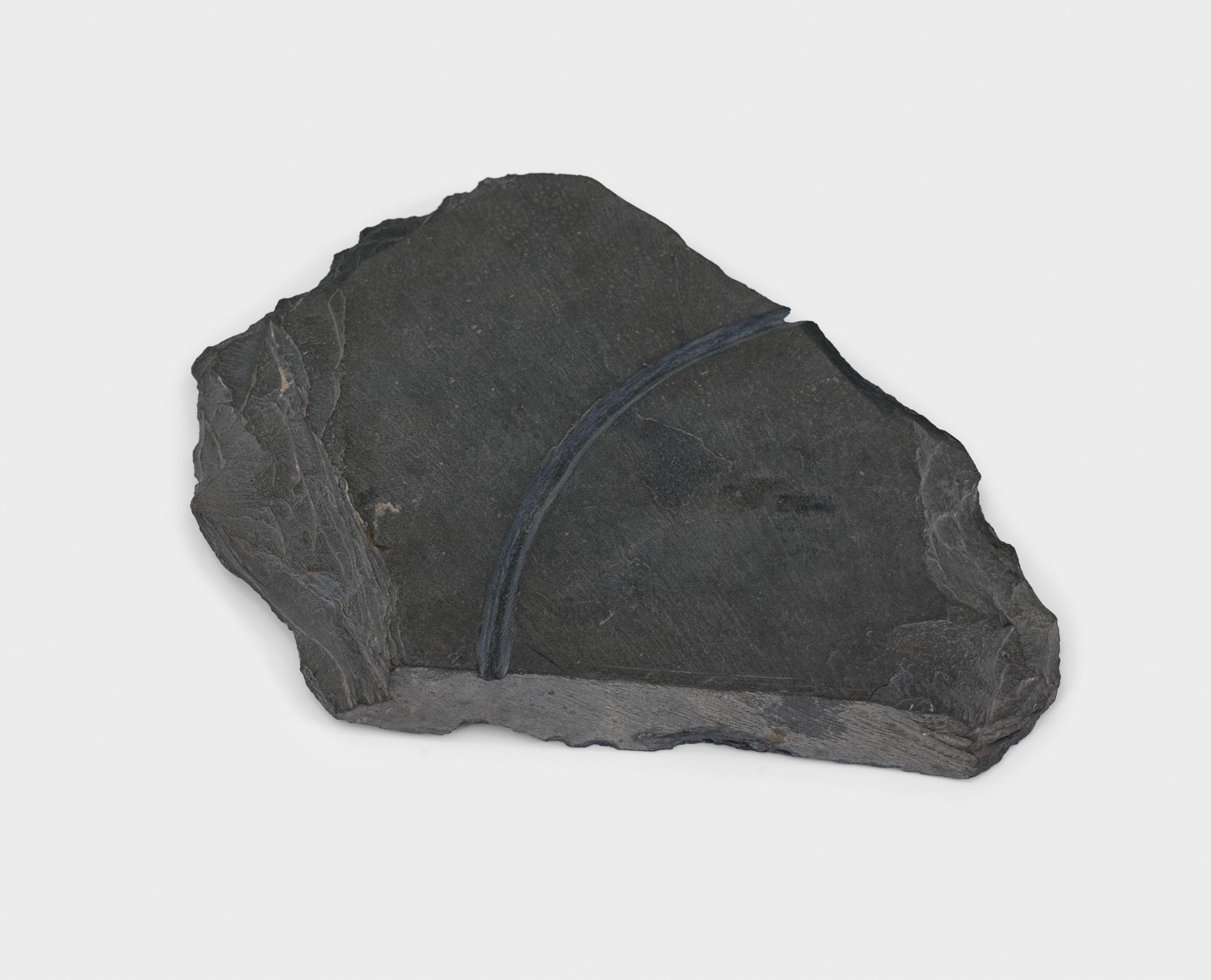 a large piece of slate with a circular incision