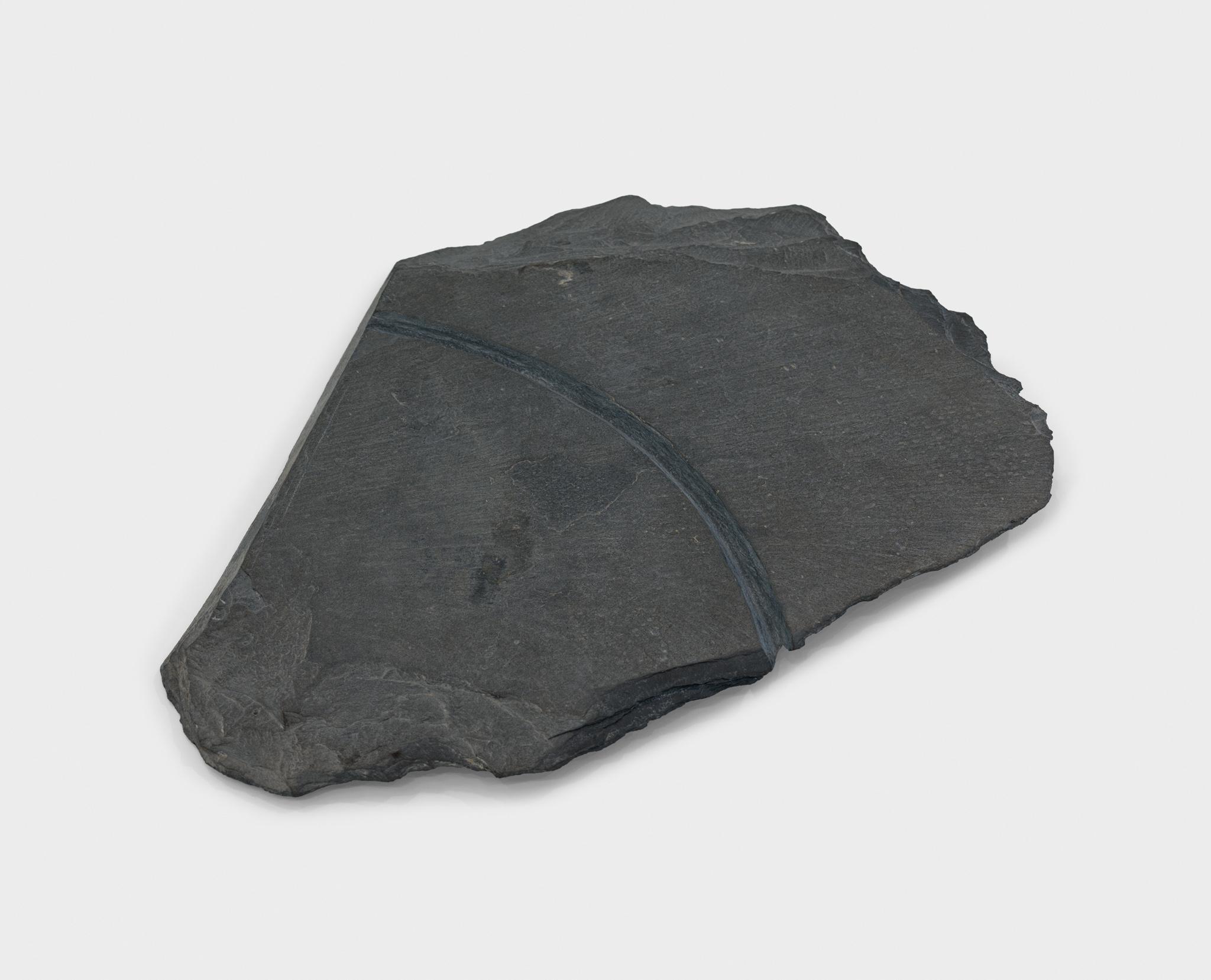 a large piece of slate with a circular incision