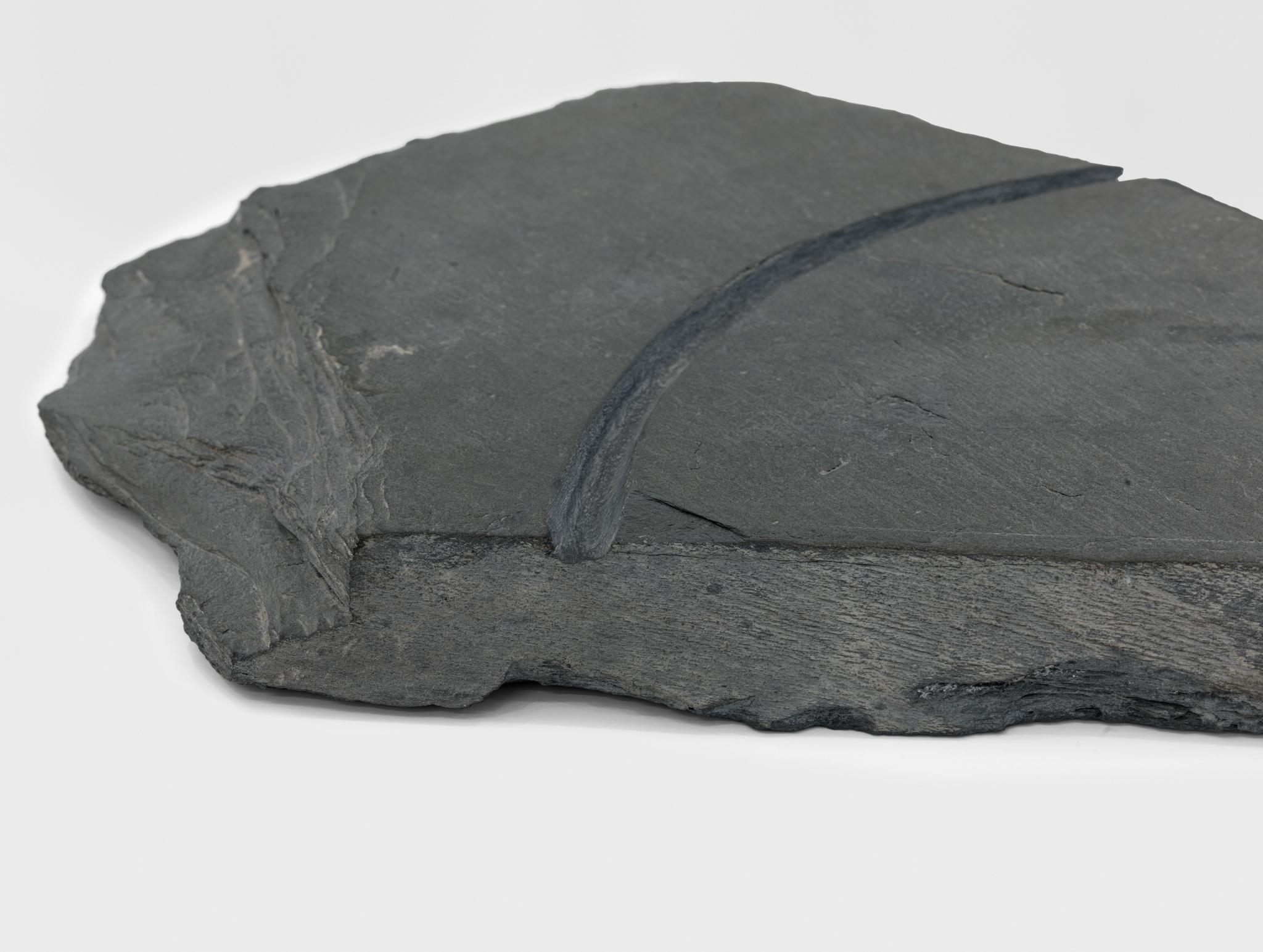 a large piece of slate with a circular incision