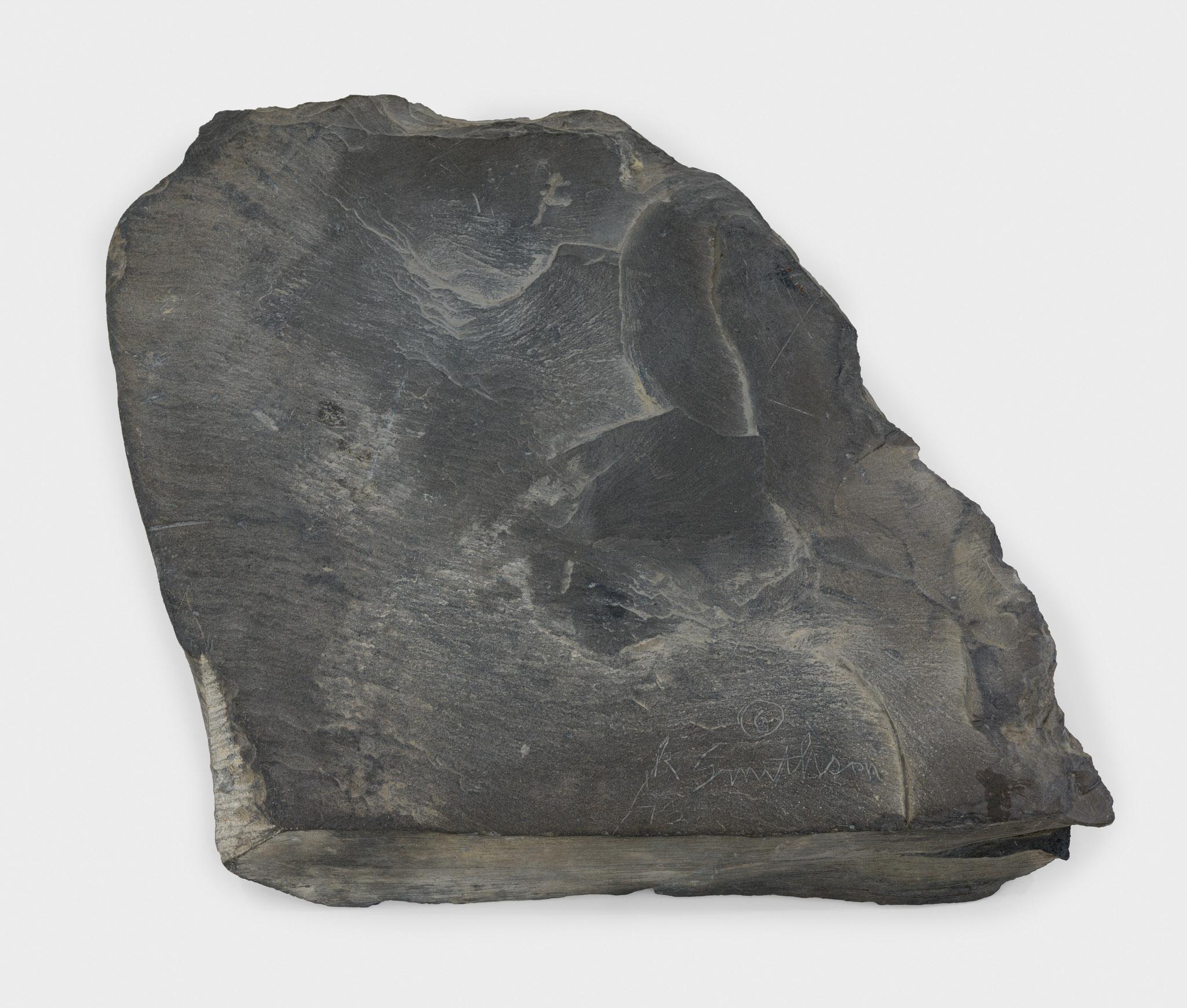 a large piece of slate with a circular incision