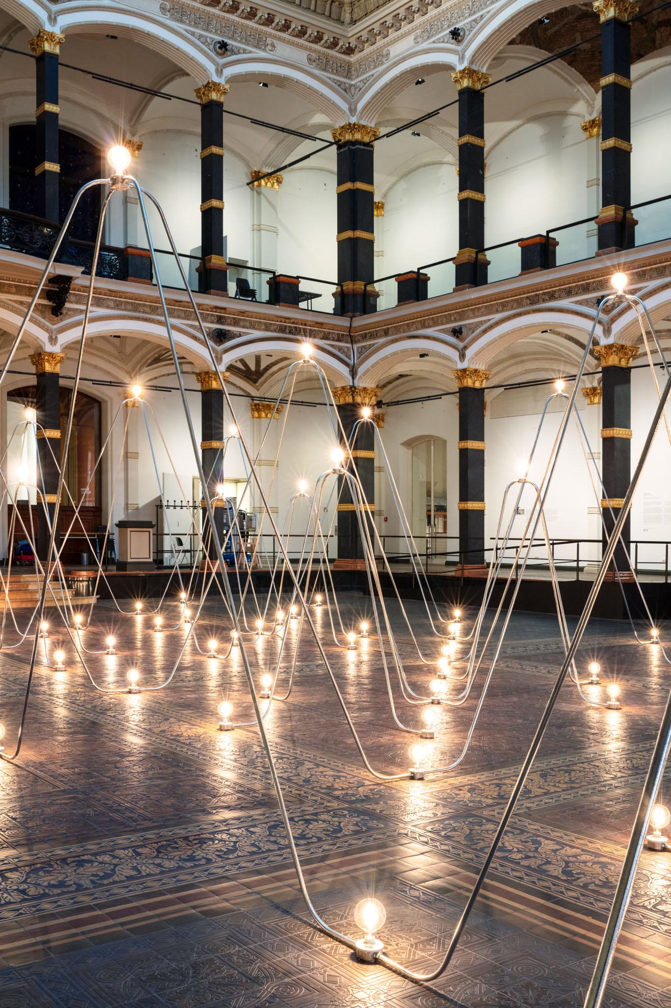 Nancy Holt's Electrical System made of conduit and lightbulbs installed in Gropius Bau