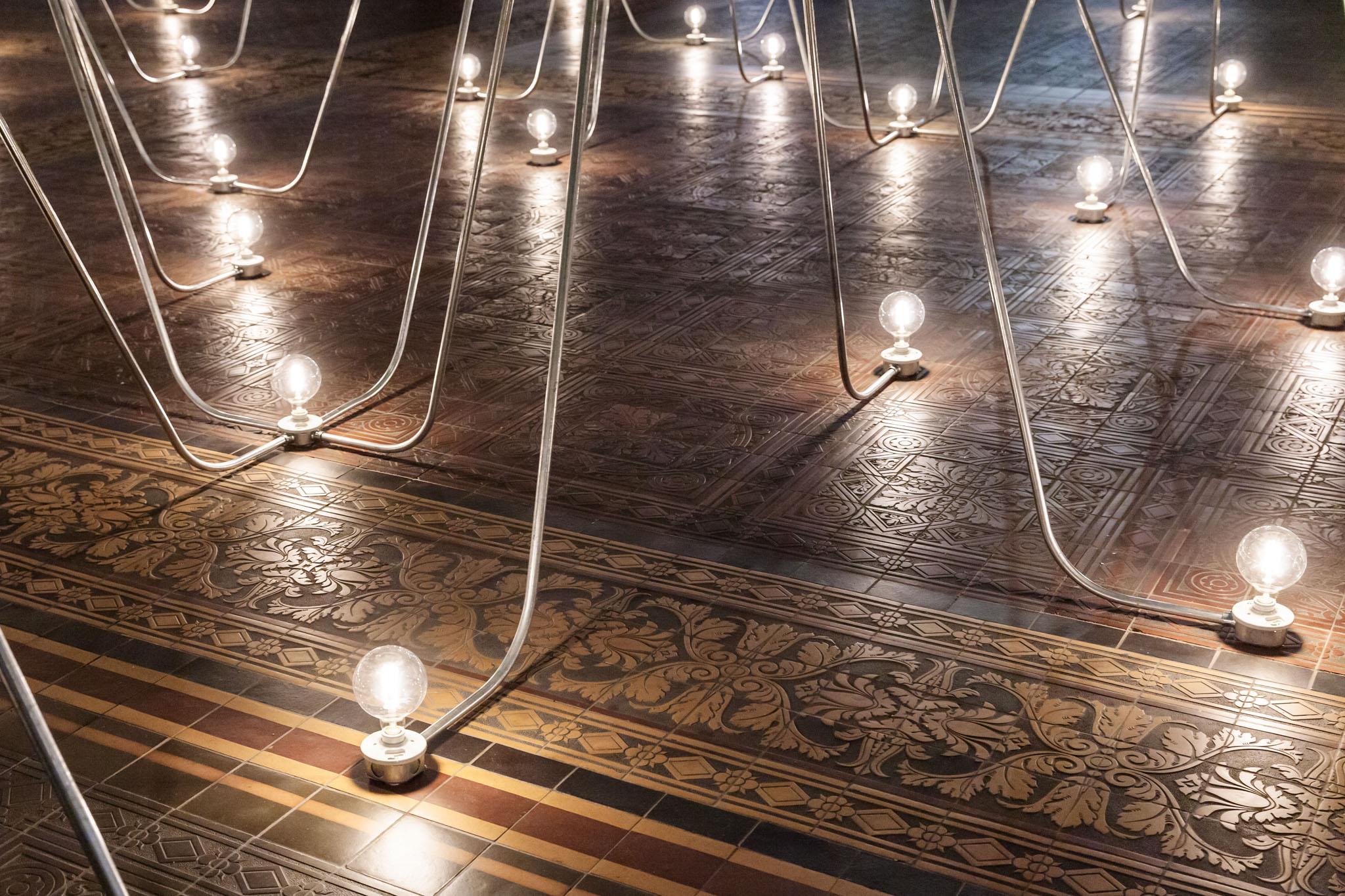 Nancy Holt's Electrical System made of conduit and lightbulbs installed in Gropius Bau