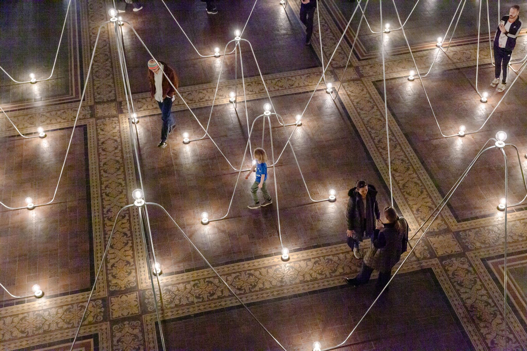 Nancy Holt's Electrical System made of conduit and lightbulbs installed in Gropius Bau