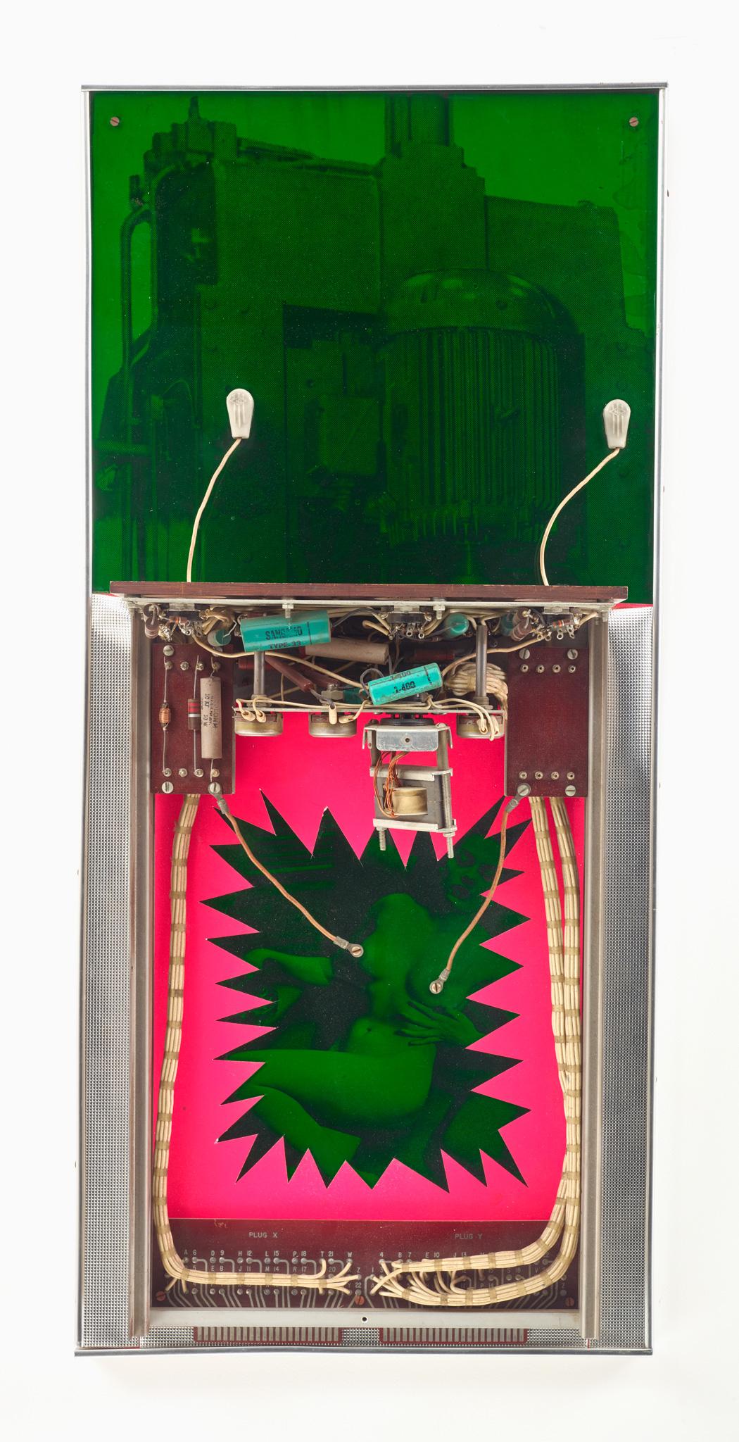 a wall sculpture with bright neon colors and machine parts interacting with a cutout image of a woman