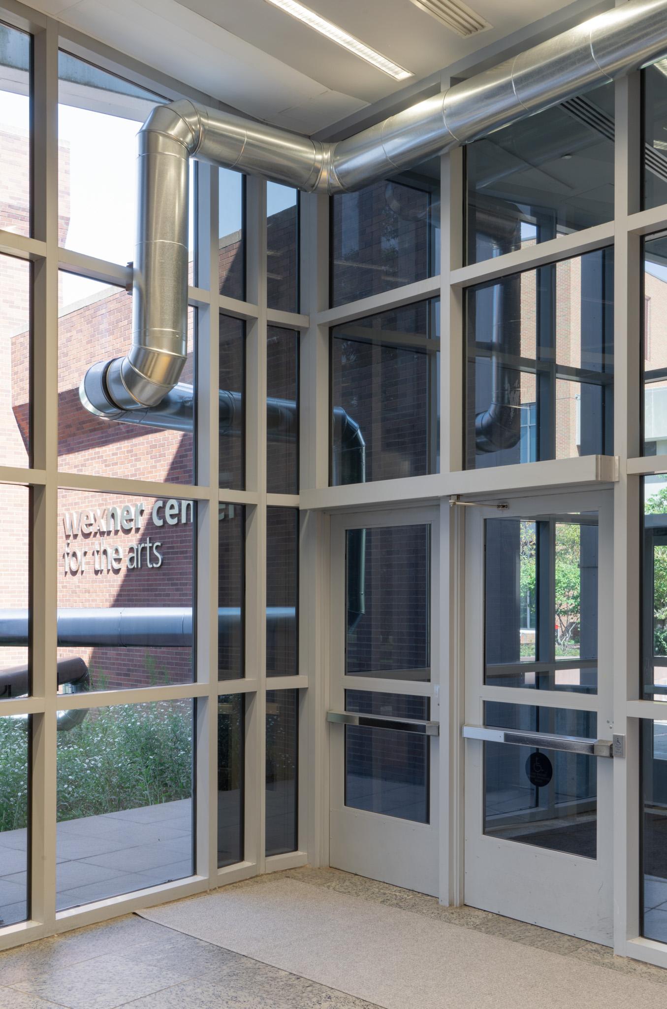 A network of steel duct winding through a building