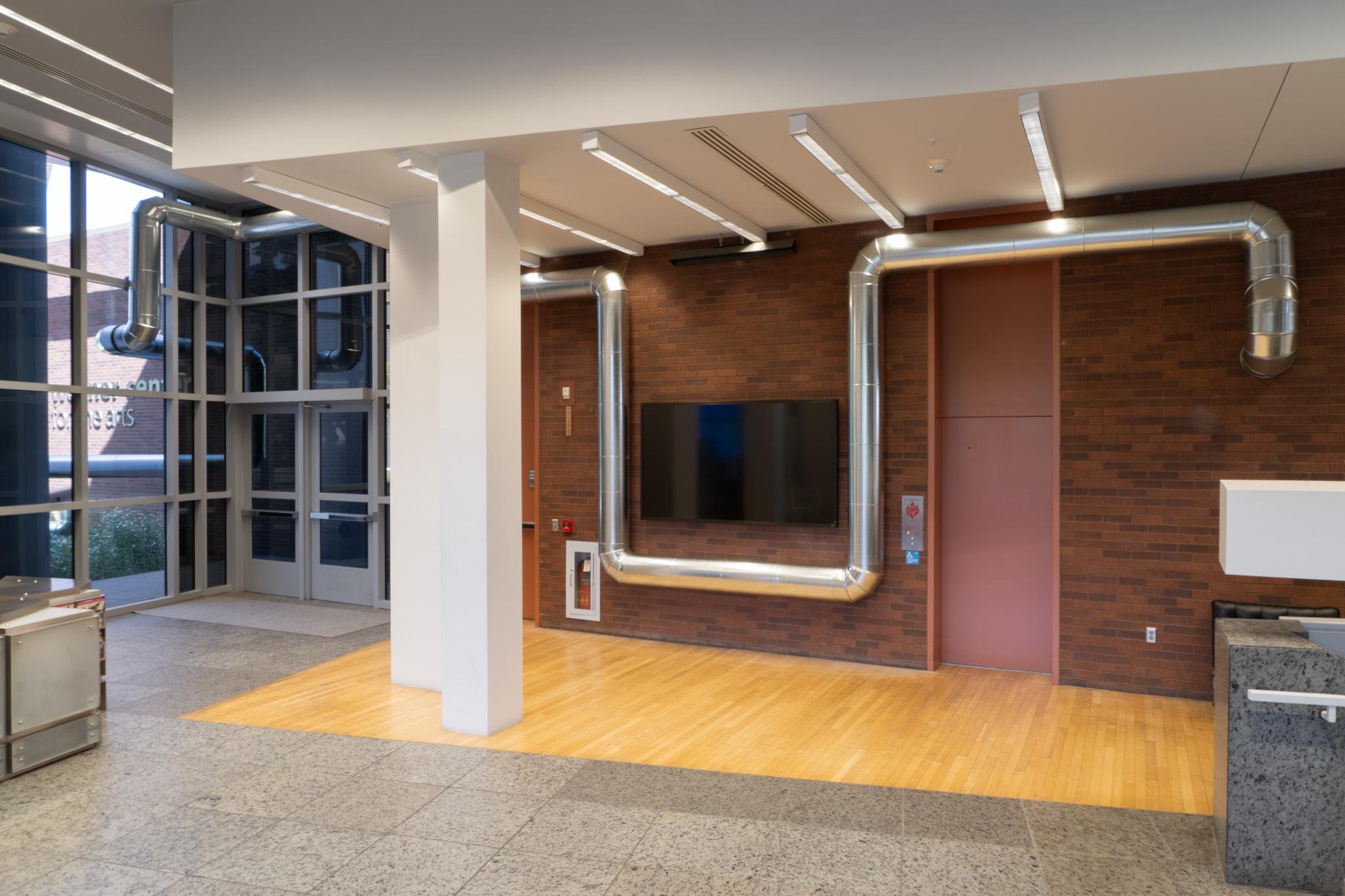 A network of steel duct winding through a building