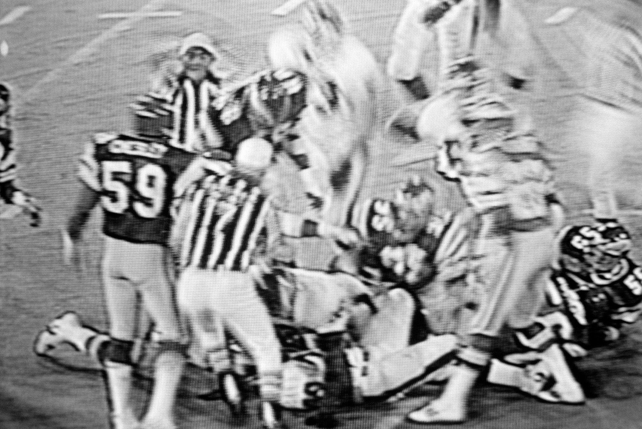 images of a broadcast professional football game showing the grain of the television