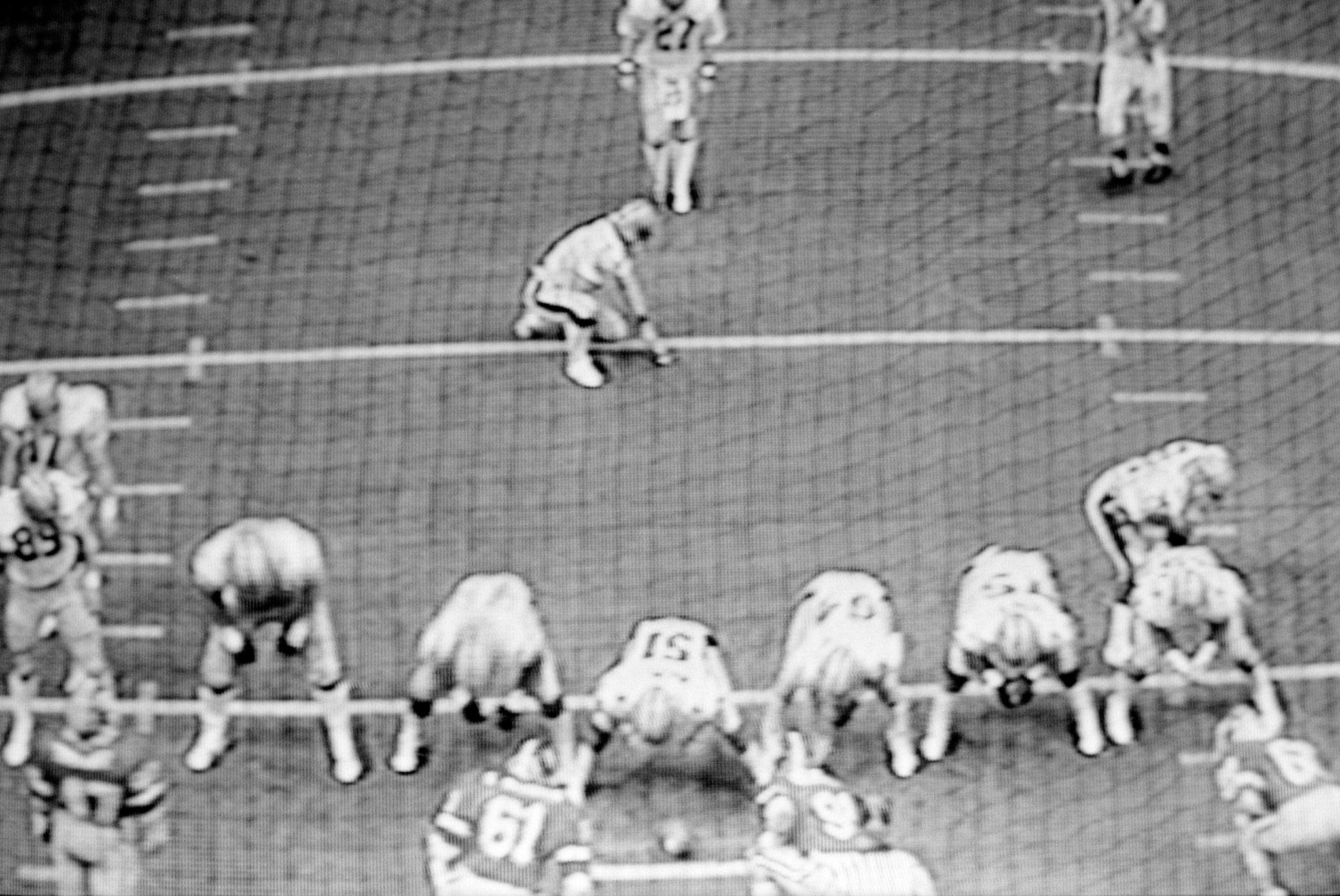 images of a broadcast professional football game showing the grain of the television