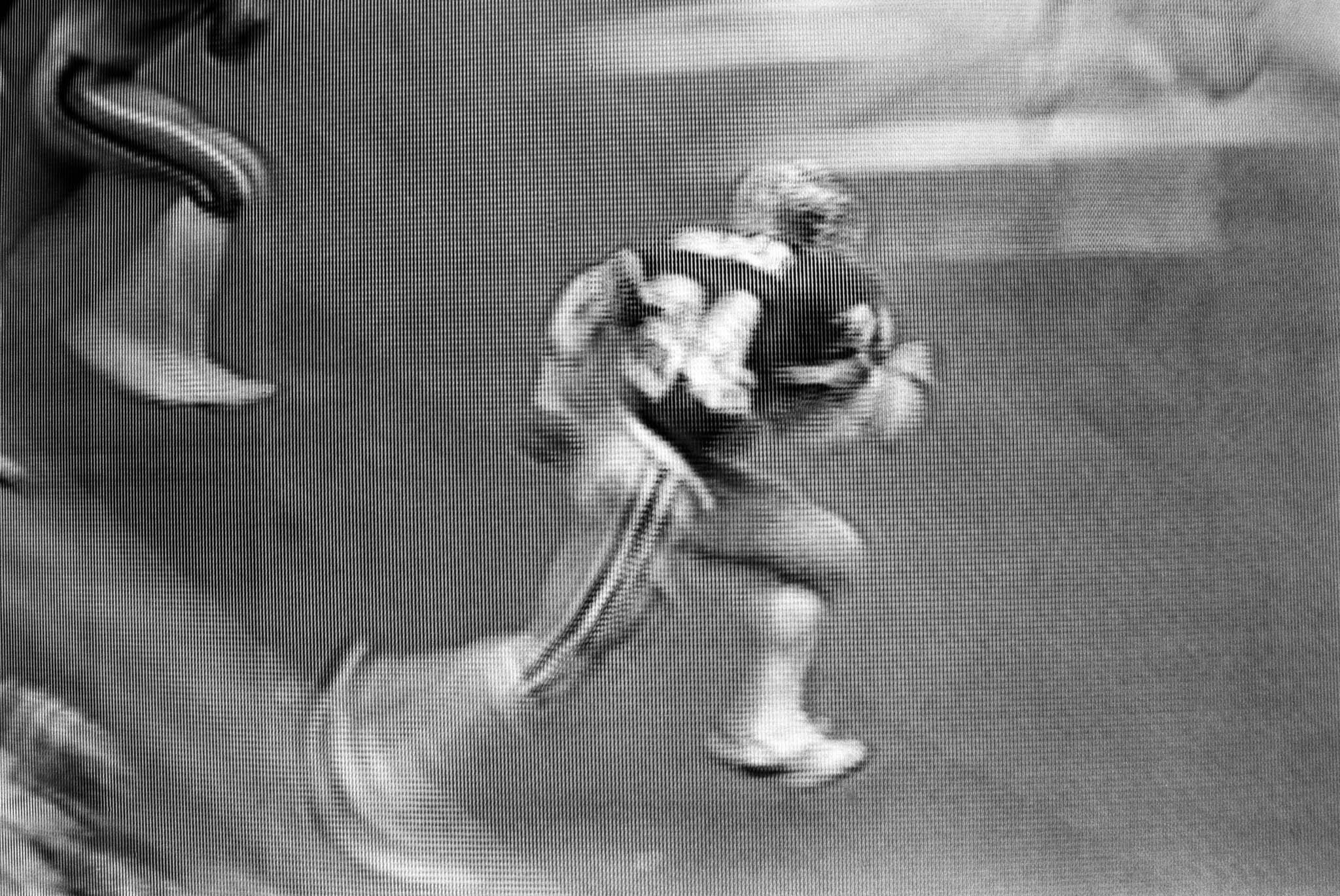 images of a broadcast professional football game showing the grain of the television