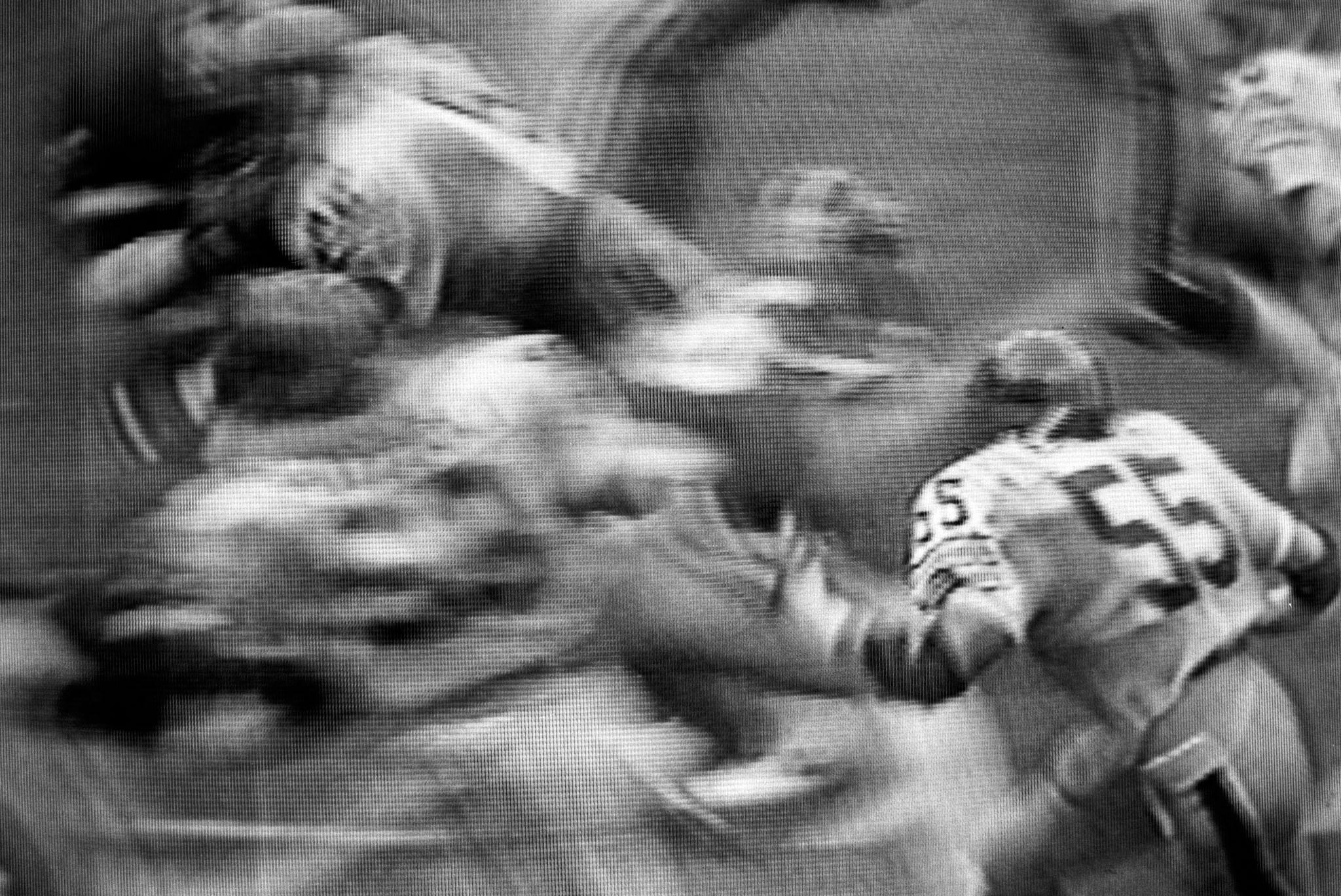 images of a broadcast professional football game showing the grain of the television