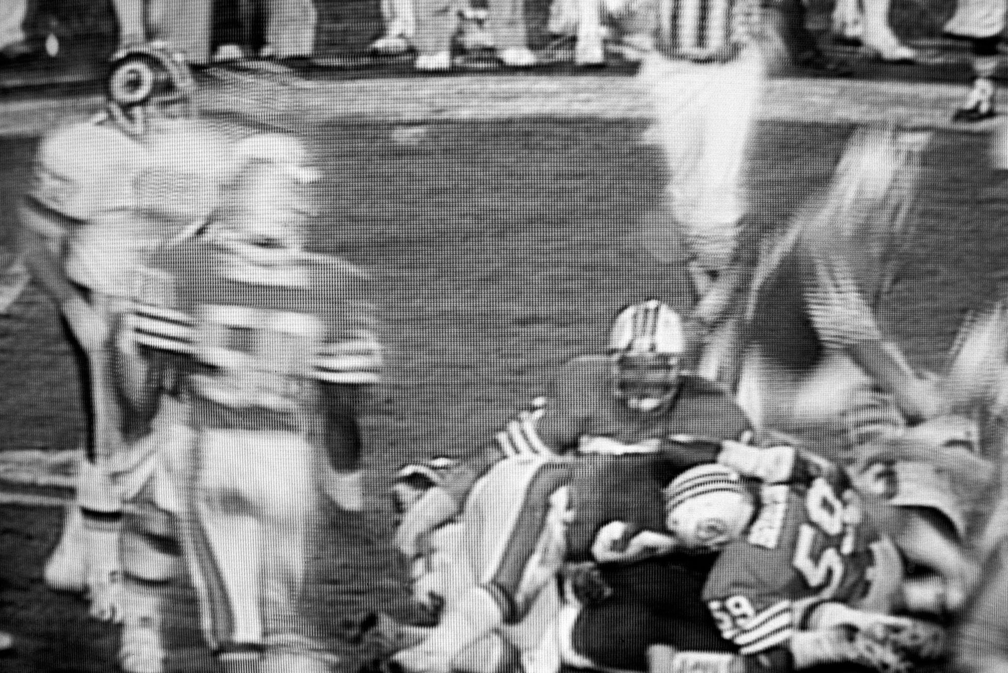 images of a broadcast professional football game showing the grain of the television