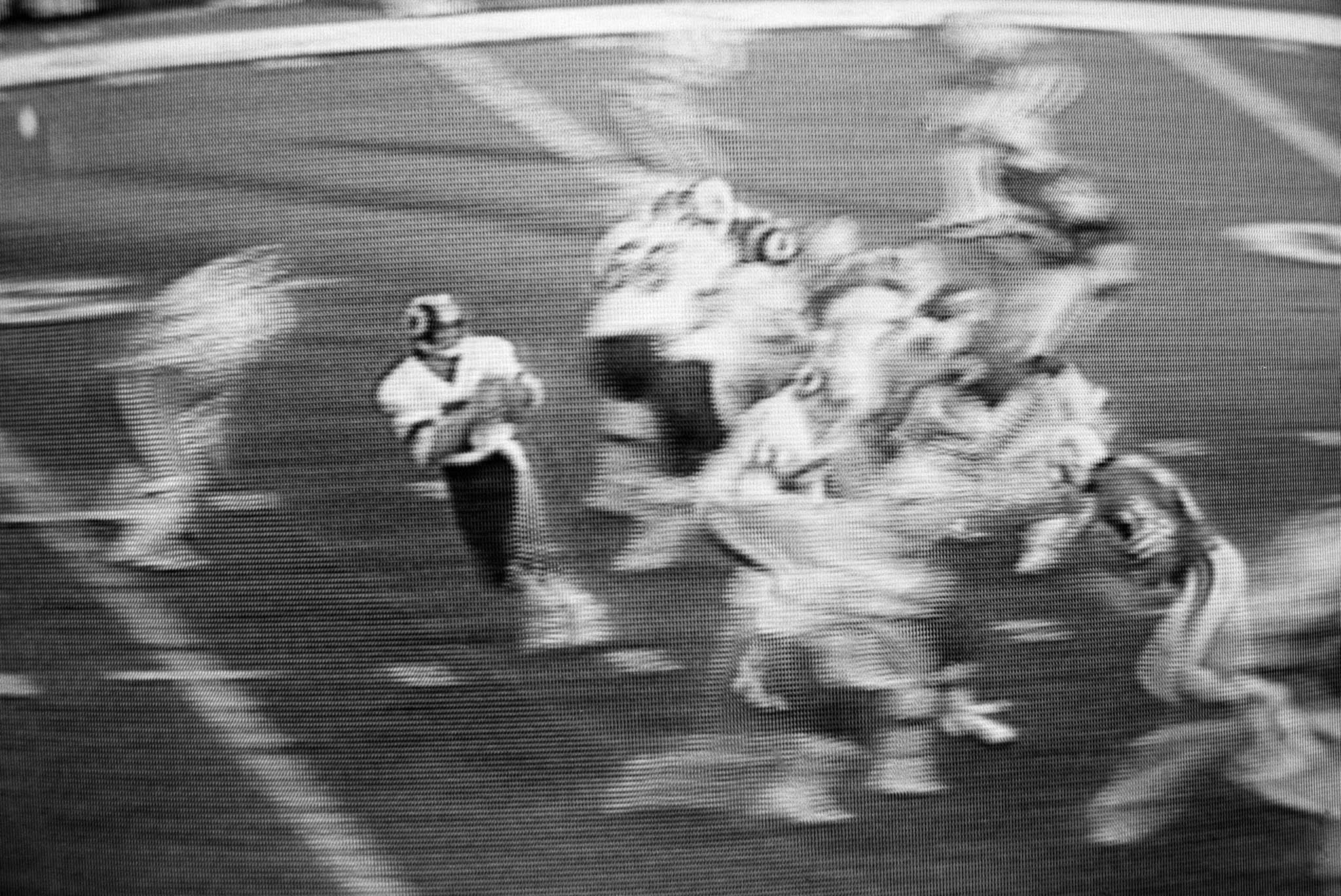 images of a broadcast professional football game showing the grain of the television
