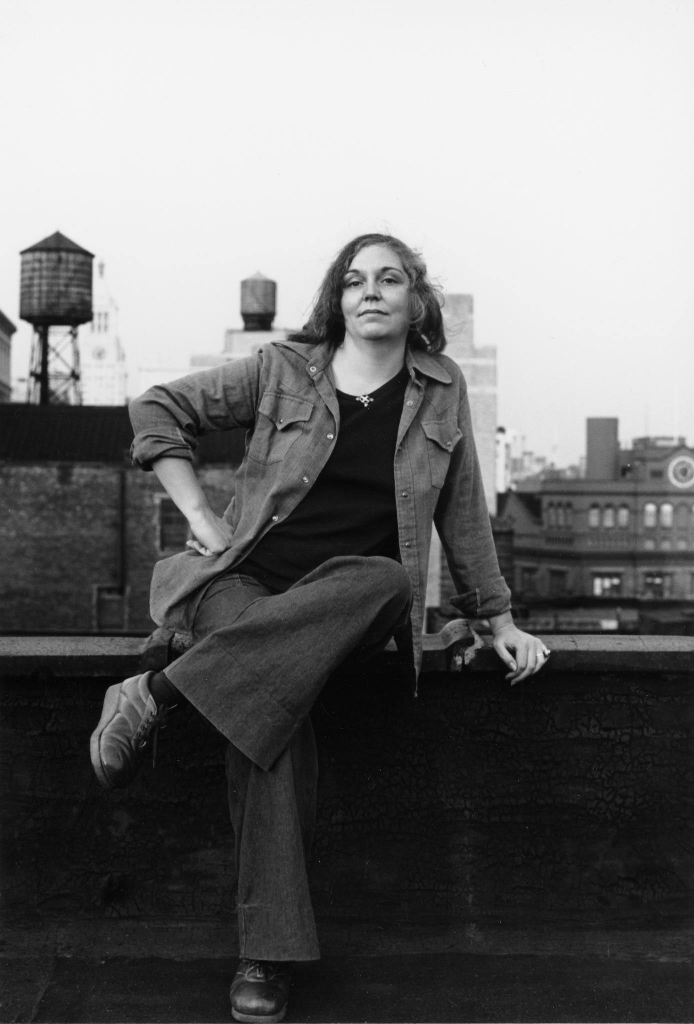 Nancy Holt sitting on a rooftop in New York City