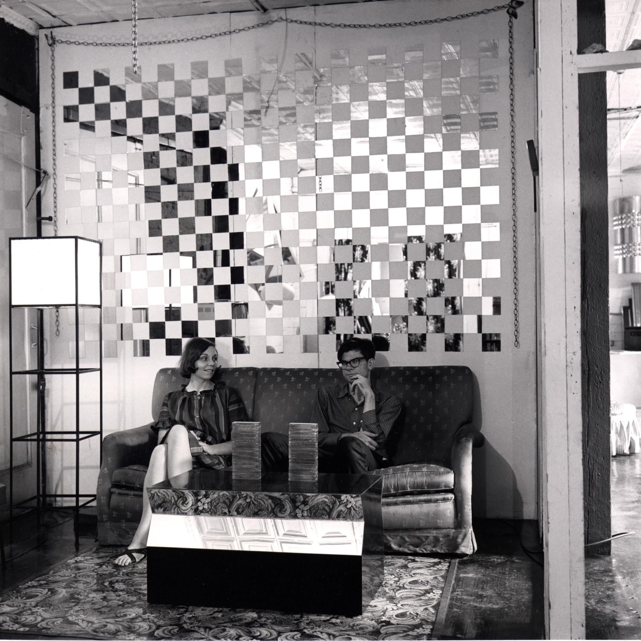 a portrait of Nancy Holt and Robert Smithson in their loft in New York City