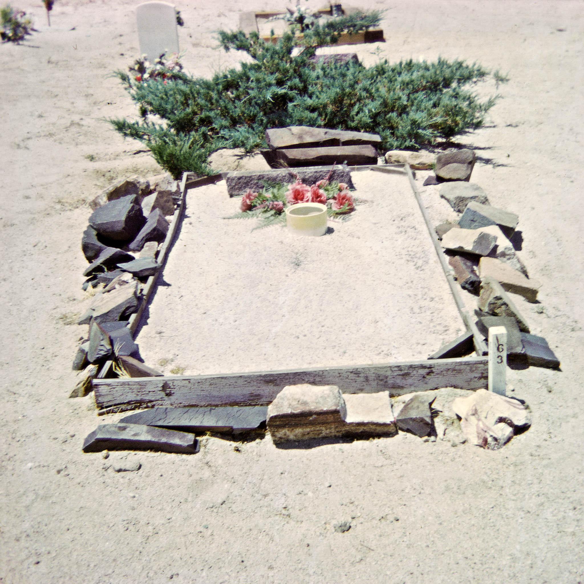gravesite in a rural western landscape