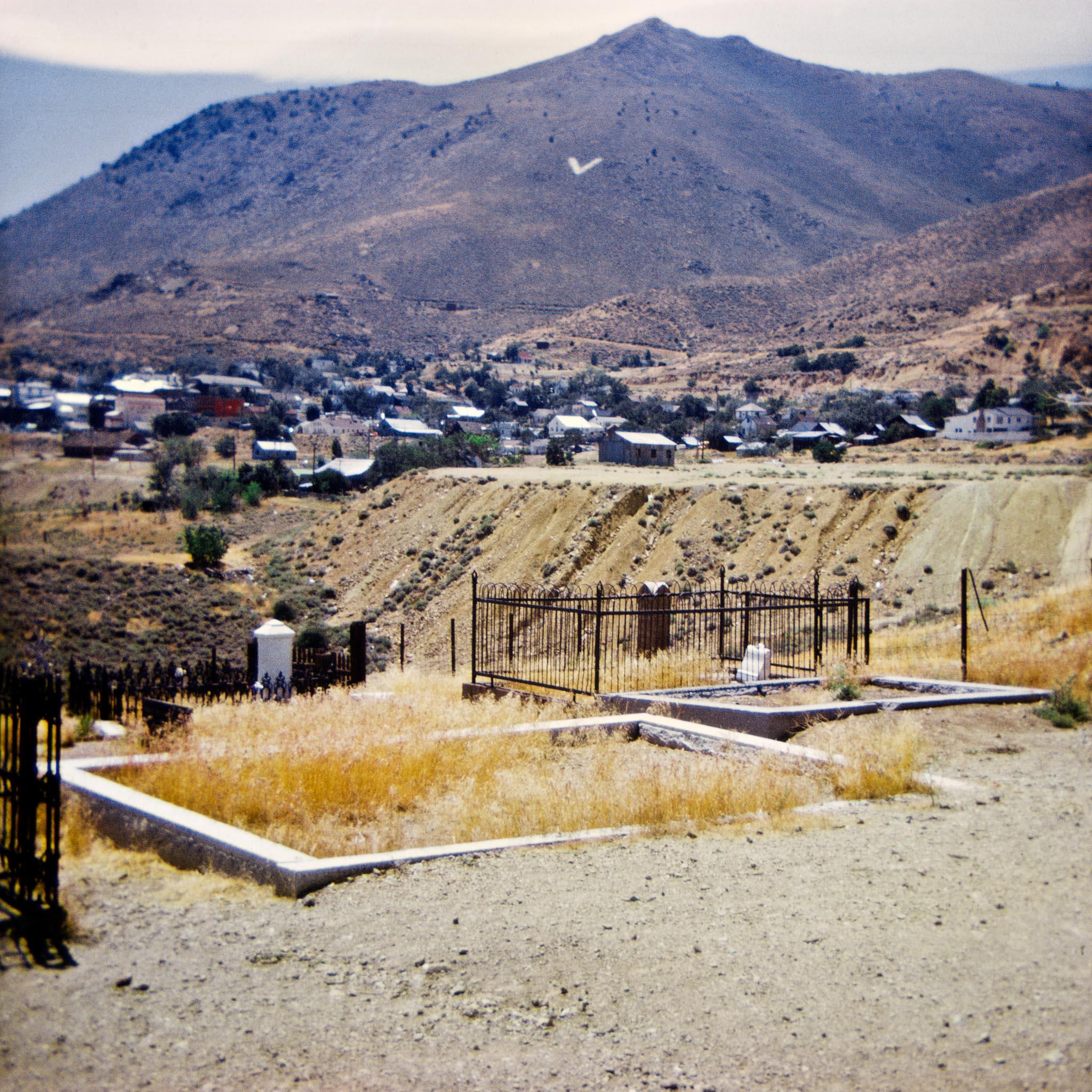 gravesite in a rural western landscape