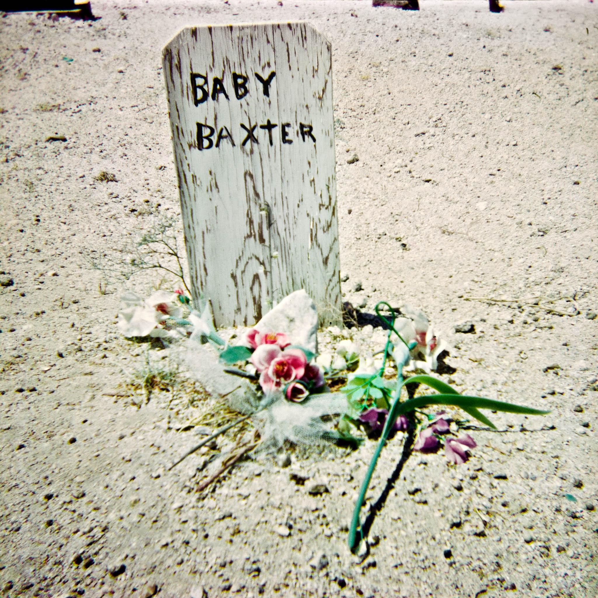 gravesite in a rural western landscape
