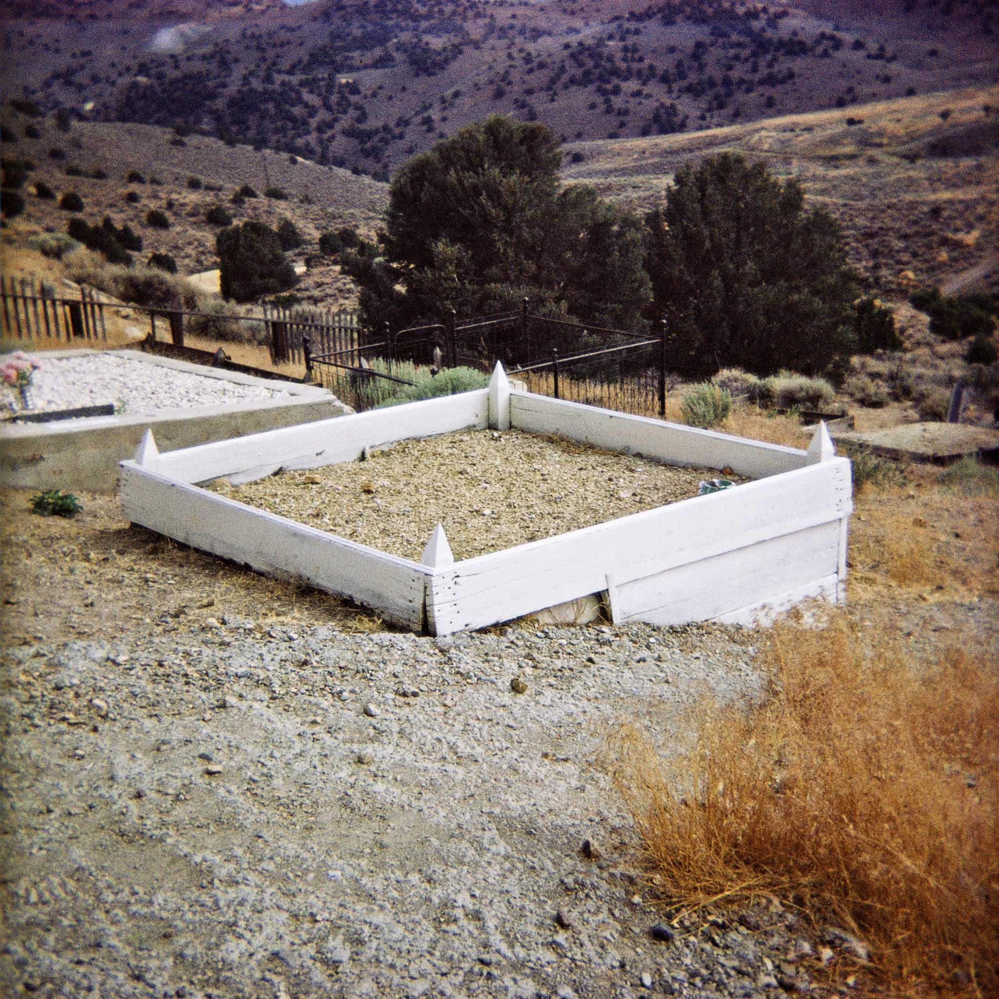 gravesite in a rural western landscape