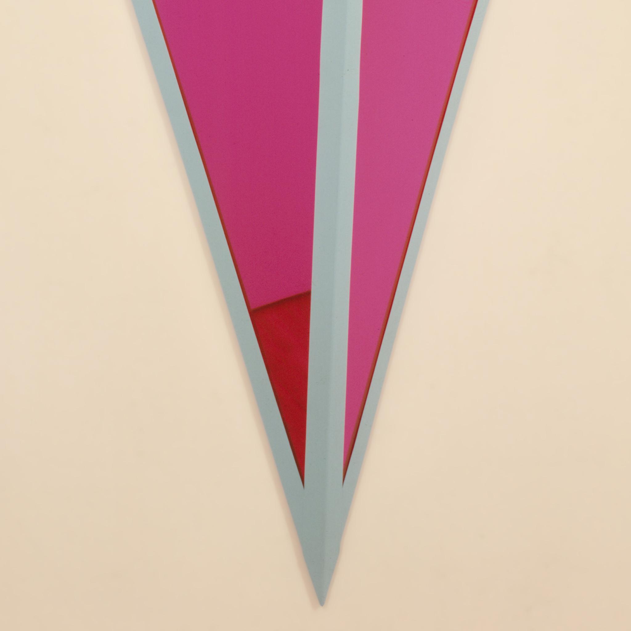 detail image of a geometric sculpture with pale blue metal frame and pink mirrored planes