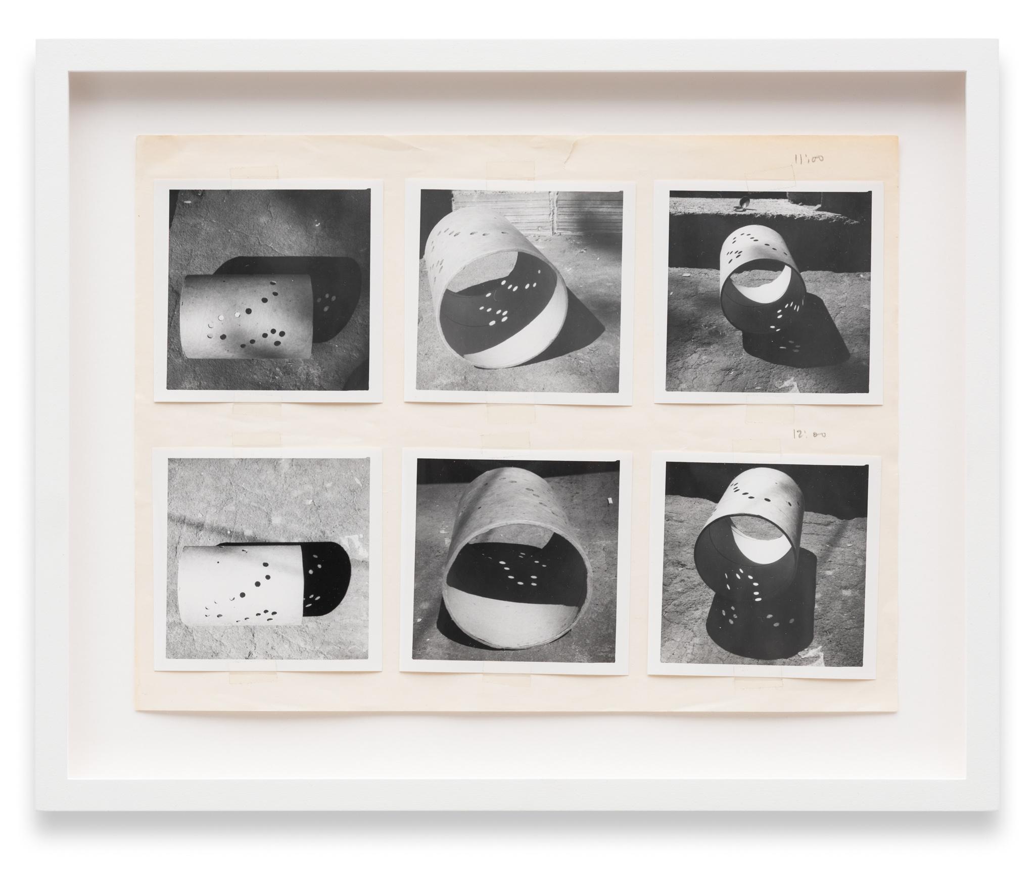 a collage of images of a cardboard tube casting shadows pasted to paper with graphite notations