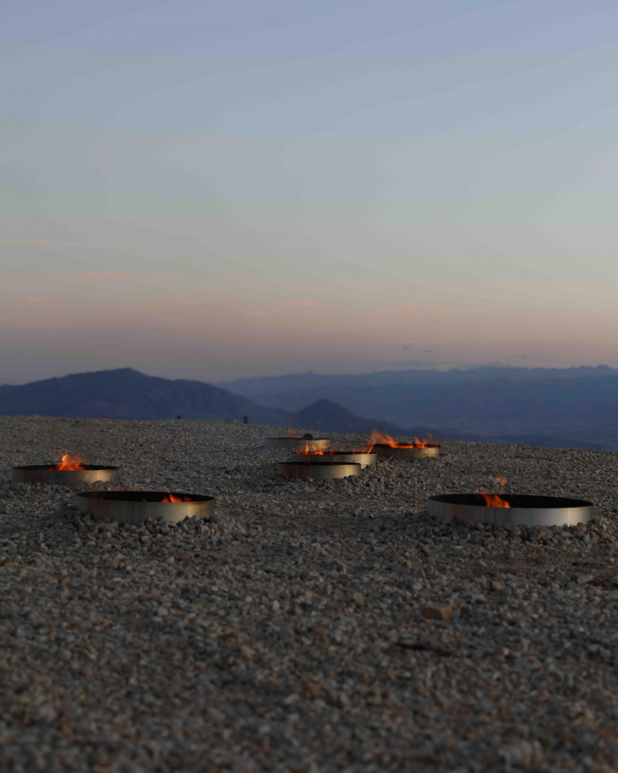 fire pits in the outline of a star constellation